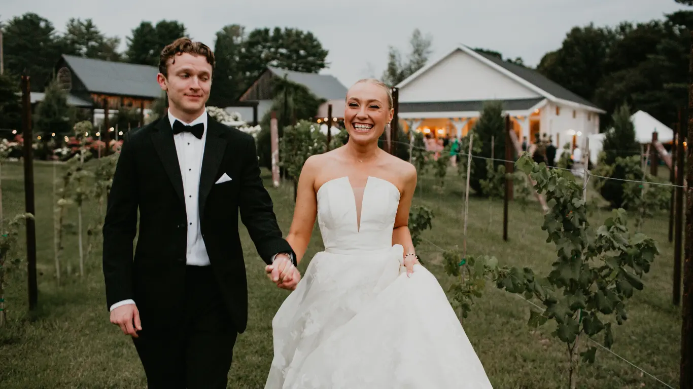 A Couple Standing Front of Barn Wedding Venue